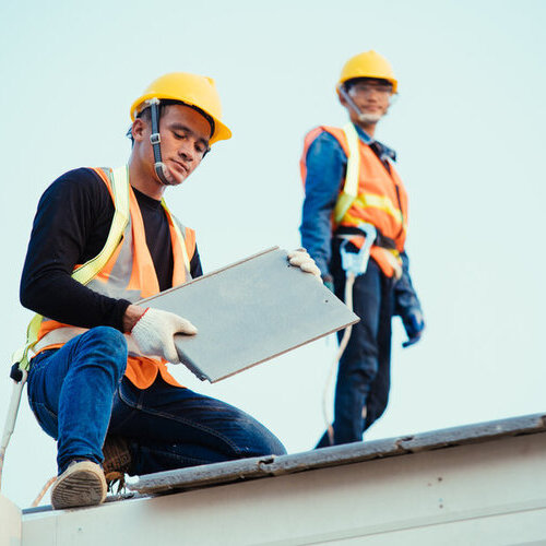 roofers performing an inspection