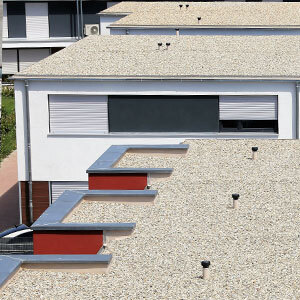 Gravel used to surface a BUR roofing system